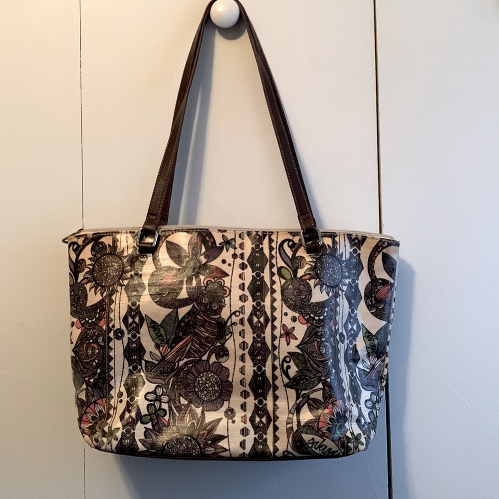 Sakroots purse.  Good condition fun pattern.  Tan and brown color tones